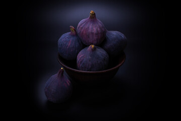 Tasty figs on a black background. Top view.