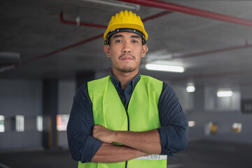 Construction worker at building site. Portrait of contruction worker.