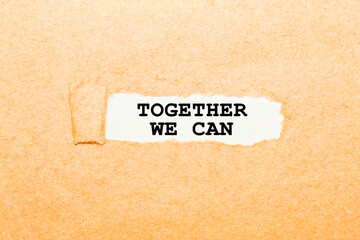 text TOGETHER WE CAN on a torn piece of paper, business concept