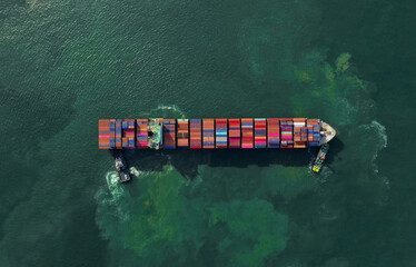 Container , container ship in export and import business and logistics. Shipping cargo to harbor by...