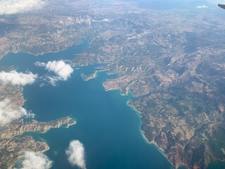 the view from the plane earth from a height flight travel sea sunset clear clouds