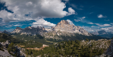 Tofana di rozes and the Tofane mountains group under a blue sky with clouds in Cortina D'ampezzo, famous ski resort in the Dolomites