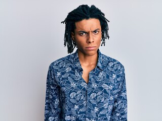 Young african american man wearing 80s style shirt skeptic and nervous, frowning upset because of problem. negative person.