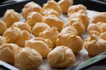 profiterole dough on the tray close up