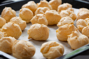 profiterole dough on the tray close up