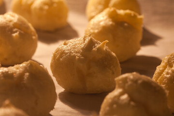 profiterole dough in the oven close up