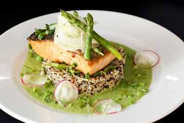 Grilled salmon with asparagus and mushy peas.