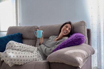 Woman at home with a cup of coffee