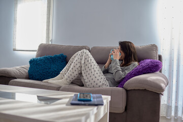 Woman at home with a cup of coffee