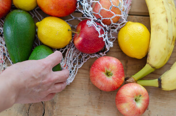 Different seasonal fruits :Apple,banana,avocado,lemon and peach
