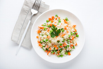 Boiled rice with vegetables, traditional Oriental dish