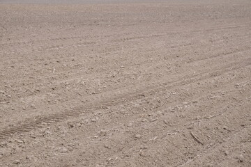 A plowed agricultural field. Fertile cultivated soil in the farm field.