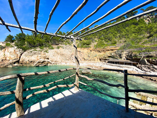 Fototapeta na wymiar Beautiful emerald turquoise water at Cala Deia, Mallorca, Balearic Islands, Spain