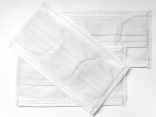 White surgical face mask on white background,  Health care concept and can protect virus covid-19, medical masks, fabric mask protect air pollution