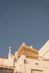 white buildings detail with sunlight and a blue sky at Cadaques town, Girona, Spain