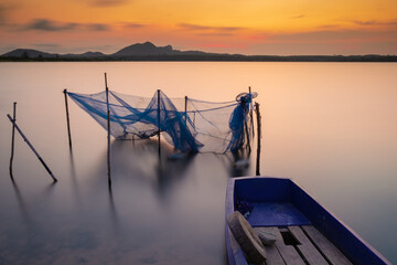 The boat and the net in the lake