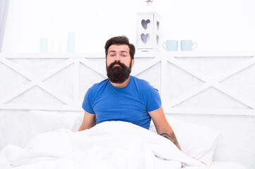 Obraz premium male body health. early wake up at morning. bachelor feel sleepy. guy at bedroom. lazy sunday. bed time routine. brutal male does not feel rested. relax lifestyle concept. tired bearded man in bed