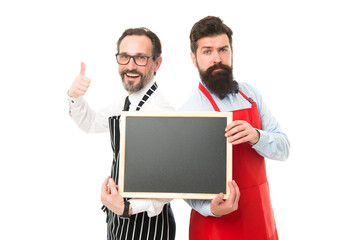 Time for healthy snack. menu planning. happy chef team in apron. partners celebrate start up. catering business. welcome on board. bearded men with blackboard, copy space. cafe and restaurant opening