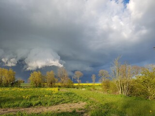 dramatic clouds over rural landscape