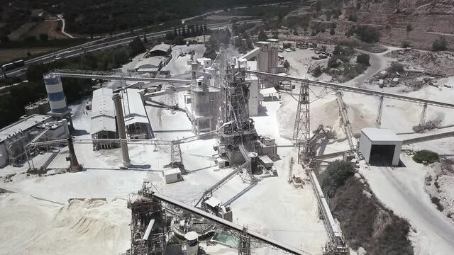 large Quarry Stone sorting conveyor belts and an open pit mine. 