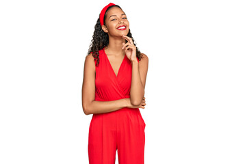 Young african american girl wearing elegant and sexy look looking confident at the camera with smile with crossed arms and hand raised on chin. thinking positive.