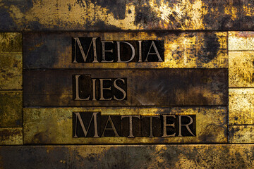 Media Lies Matter text message on vintage textured grunge copper and gold background