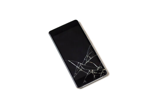 A damaged mobile phone or smartphone with a broken display on a white background close-up.Isolated.