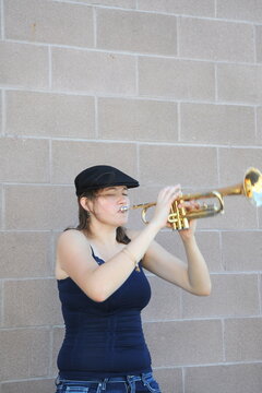 Female jazz trumpet blowing her horn.