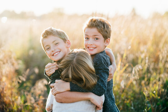 Portrait of young siblings hugging each other