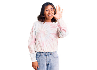 Young beautiful mixed race woman wearing casual tie dye sweatshirt showing and pointing up with fingers number five while smiling confident and happy.