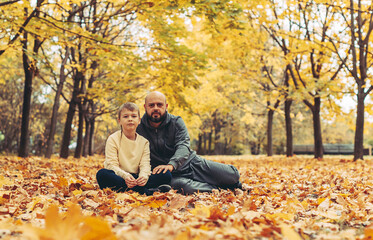 father and son in the autumn Park spend time together