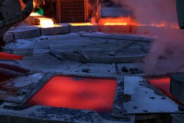 View of the copper casting to the molds in the smelting of the industrial plant. Smelting is a...