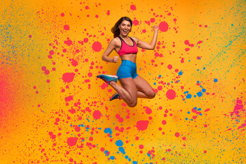Sport woman jumps on a yellow background. Happy and joyful expression. Spray effect