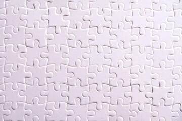 Puzzle background, white puzzle consists of many pieces