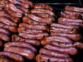 Close up of fresh beef sausage on a grill