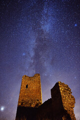 a castle with the milky way in the background