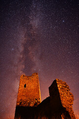 a castle with the milky way in the background