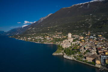 Fototapeta na wymiar Malcesine town, Lake Garda, Italy. Italian resort on Lake Garda, Monte Baldo. Panoramic aerial view of the Scaliger Castle in Malcesine in Malcesine.