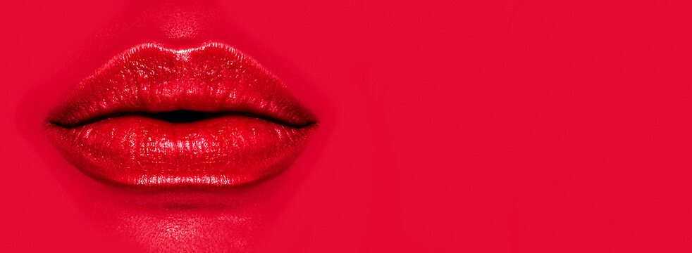 Beautiful young woman's lips closeup, on red background. Plastic surgery, fillers, injection. Part of the model girl face, youth concept. Perfect mouth, make-up. Health care. Art design. 