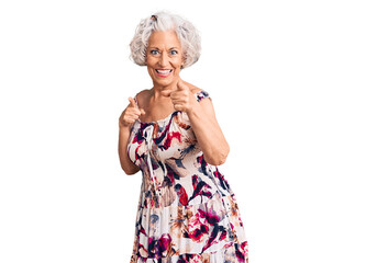 Senior grey-haired woman wearing casual clothes pointing fingers to camera with happy and funny face. good energy and vibes.