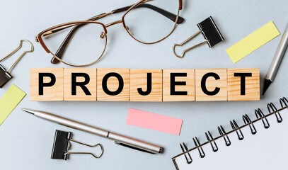 PROJECT word on wooden cubes on office desk