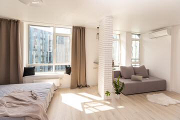 Fototapeta na wymiar Modern minimalist design of bright living room
