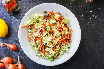 fresh salad vegetables Chinese cabbage, carrots, onions, peppers and more meal on the table tasty serving size portion top view copy space for text food background rustic keto or paleo diet