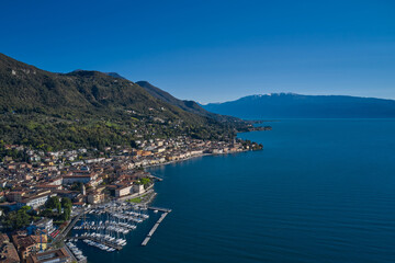 Fototapeta na wymiar Boat parking top view. Panoramic view of the historic part of Salò on Lake Garda Italy. Tourist site on Lake Garda. Aerial view of the town on Lake Garda.