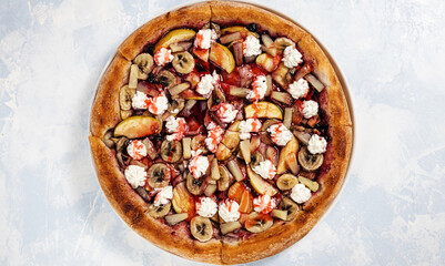 pizza on a blue sky bright light background top view