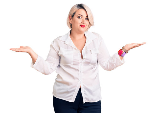 Young blonde plus size woman wearing casual shirt clueless and confused expression with arms and hands raised. doubt concept.