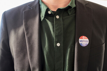 I Voted Today sticker on a man's coat lapel for the US presidential election