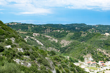 View of the greeny inland of Corfu island with mountains in Albania in the background