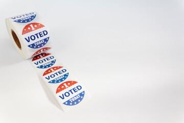 Roll of I Voted Today stickers on white background with copy space