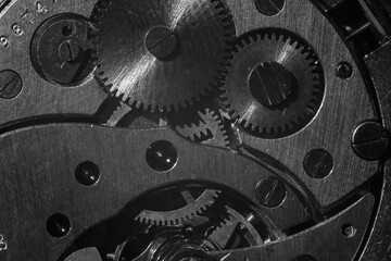 closeup of the gears of an antique clockwork